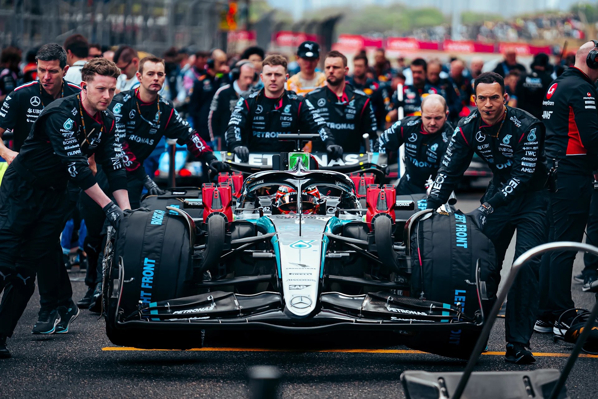 Cars and crew on the starting grid
