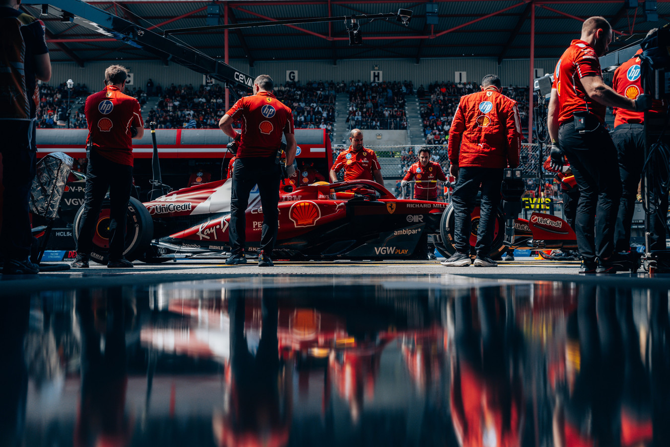 Ferrari mechanics in the pit lane